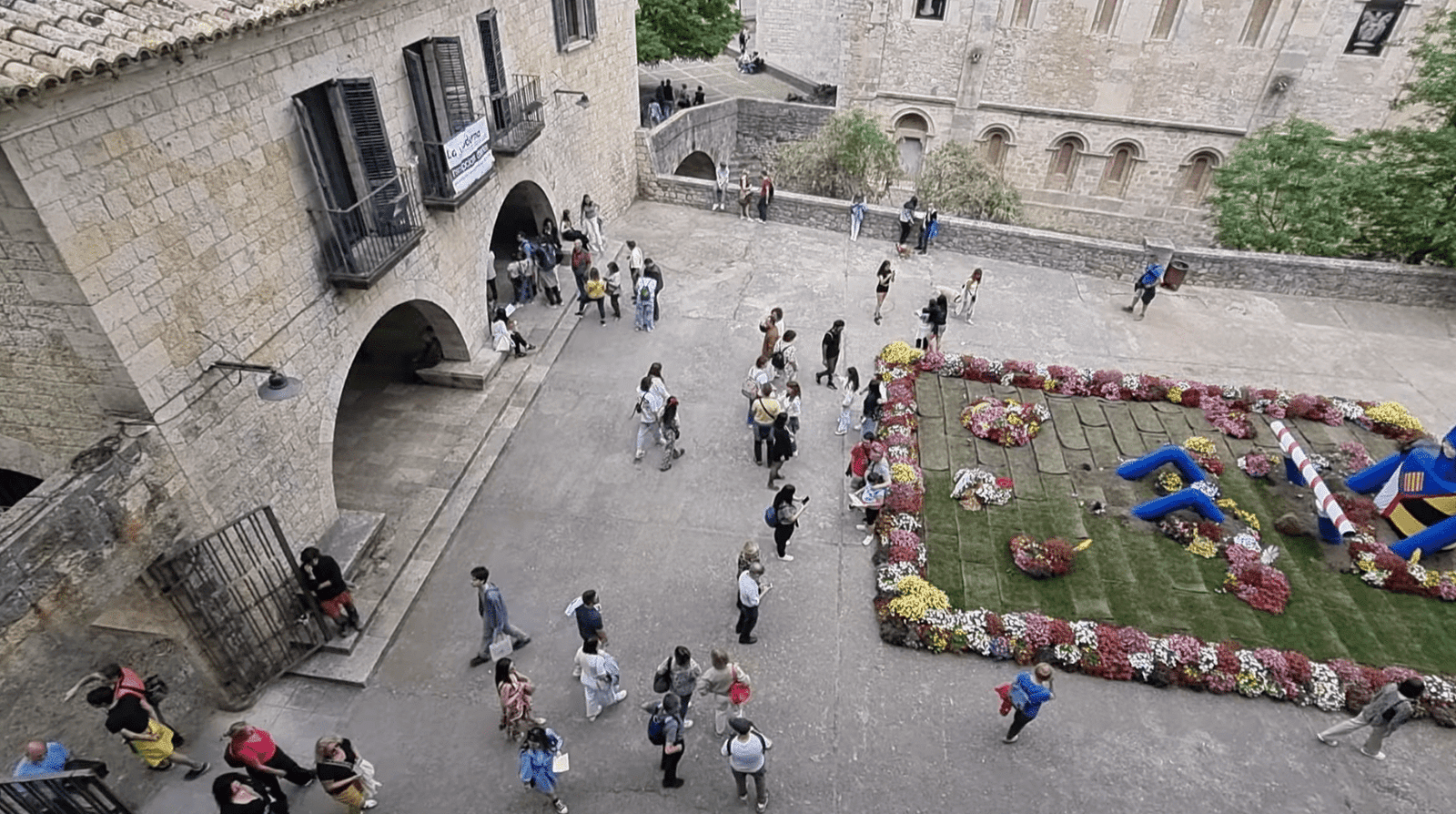 Elevated view of Girona showcasing historic architecture and flower installations during Temps de Flors