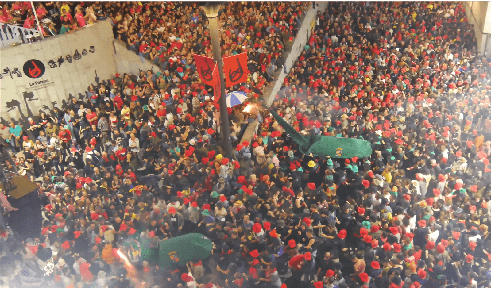 Crowd of fire devils and spectators during the Salt de Plens in La Patum