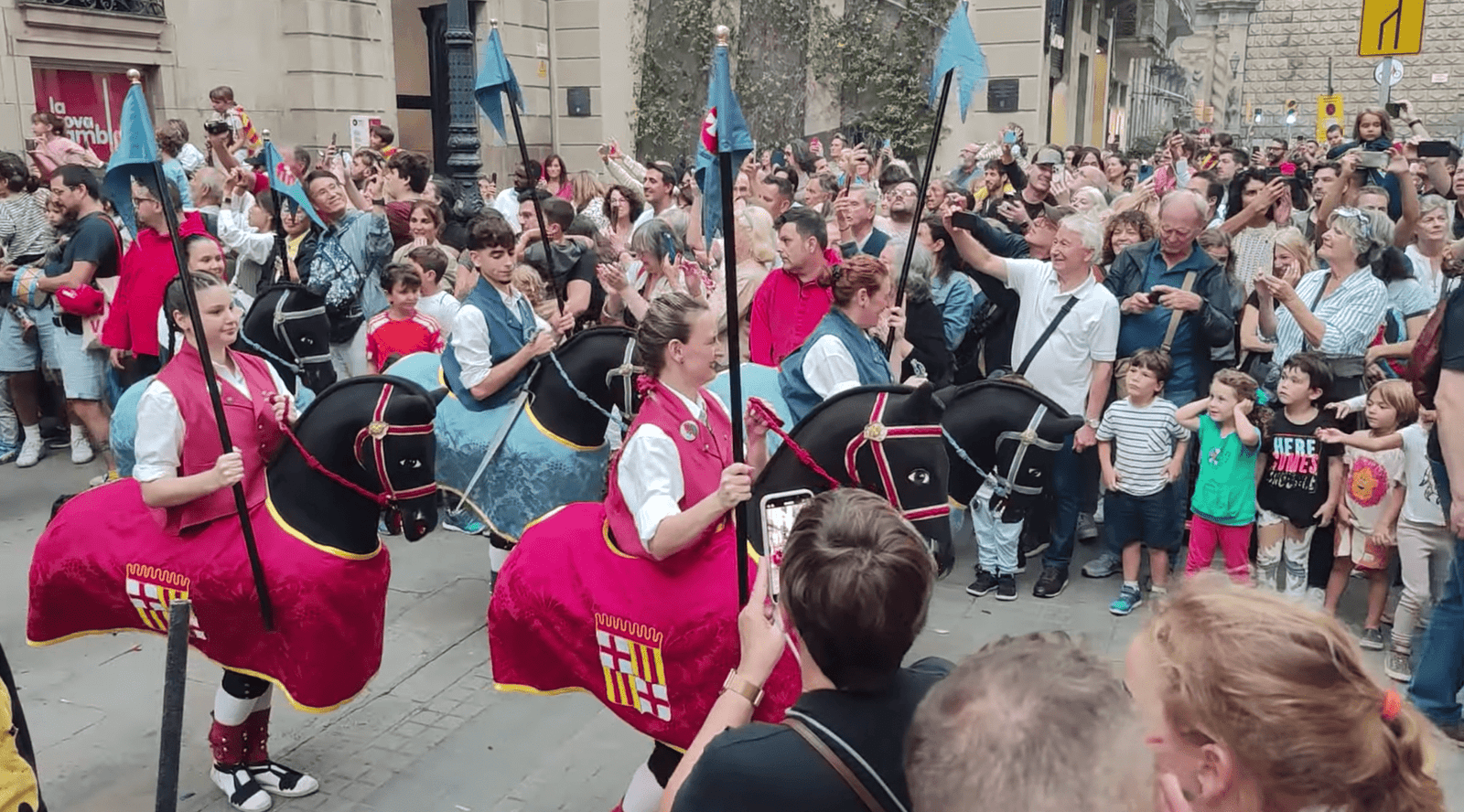 Traditional folkloric characters like the Cavallets Cotoners parade through the streets of Barcelona during the opening of La Mercè.