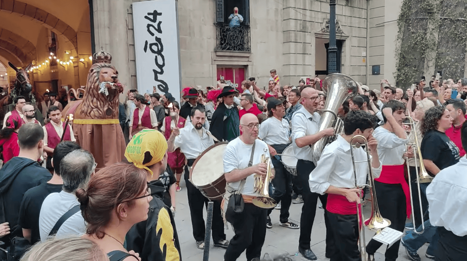 Musicians and capgrossos performing during the opening parade of La Mercè at Palau de la Virreina.