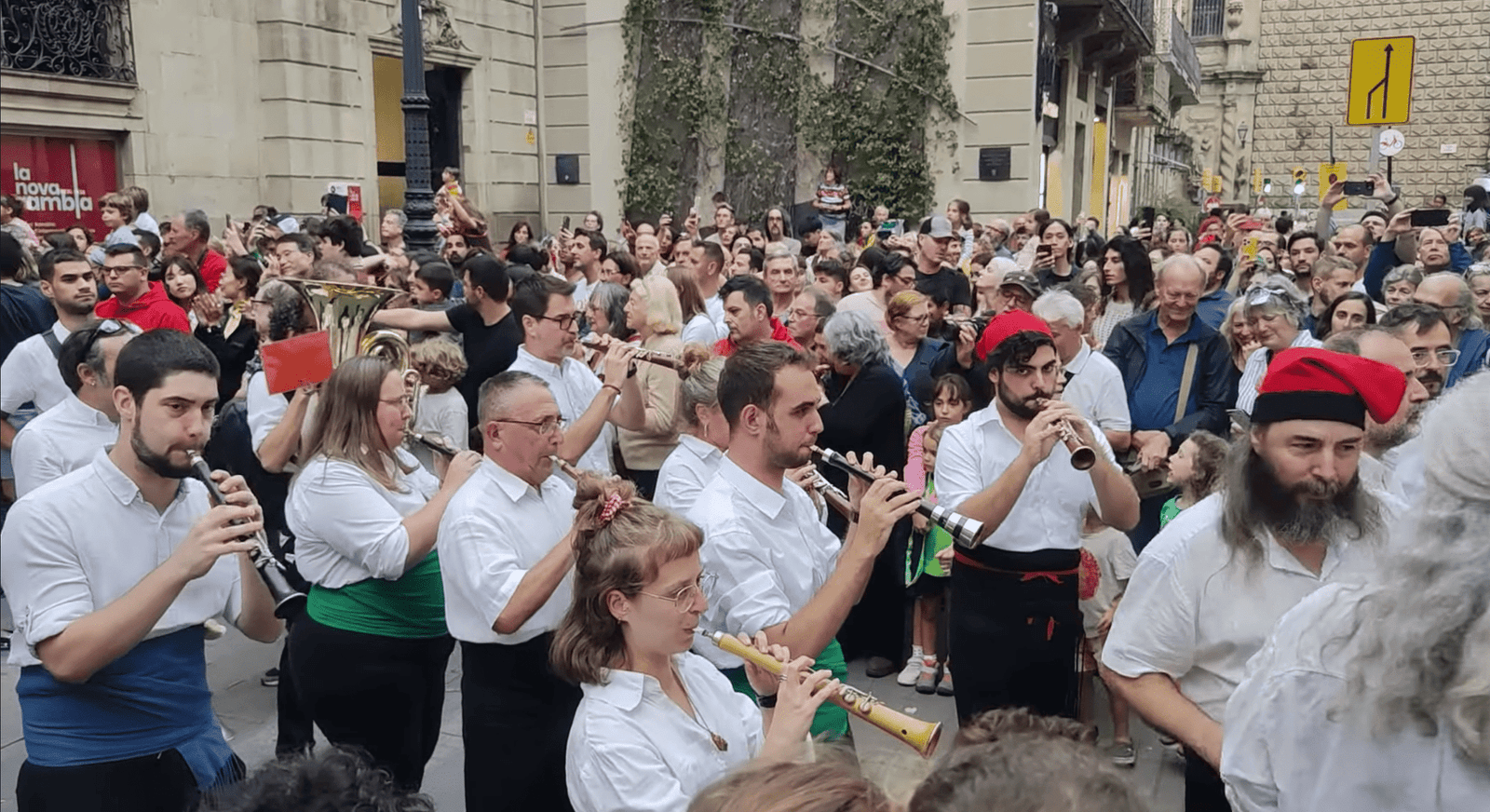 Catalan musicians playing gralles and drums in front of Palau de la Virreina during the start of La Mercè.