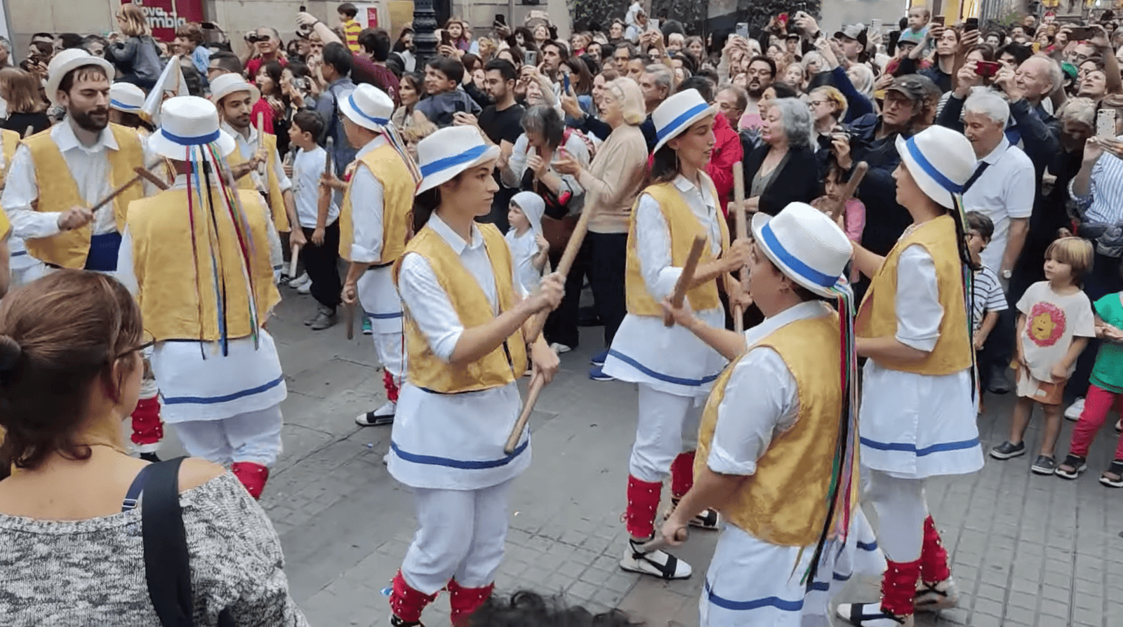 Bastoners performing a traditional stick dance during the opening parade at Palau de la Virreina, La Rambla.