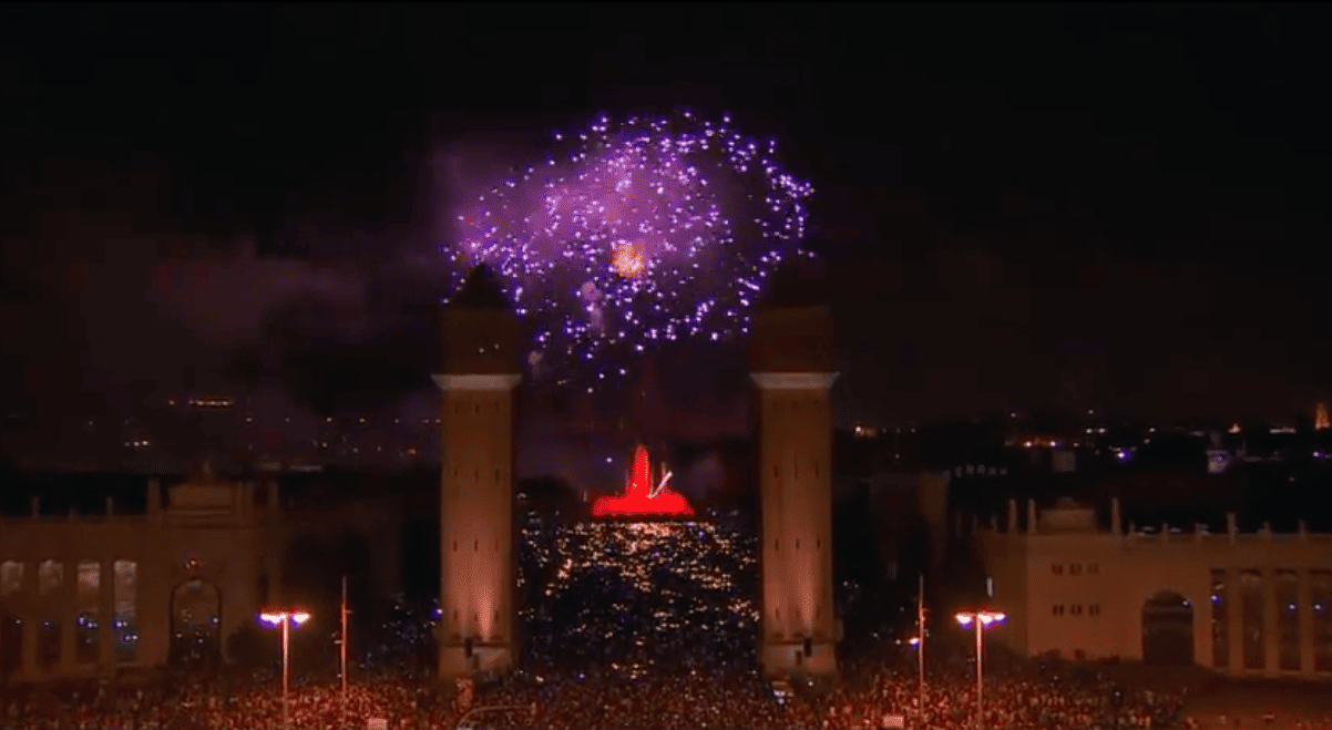 Fireworks explode over the Magic Fountain of Montjuïc during the Piromusical finale of La Mercè.