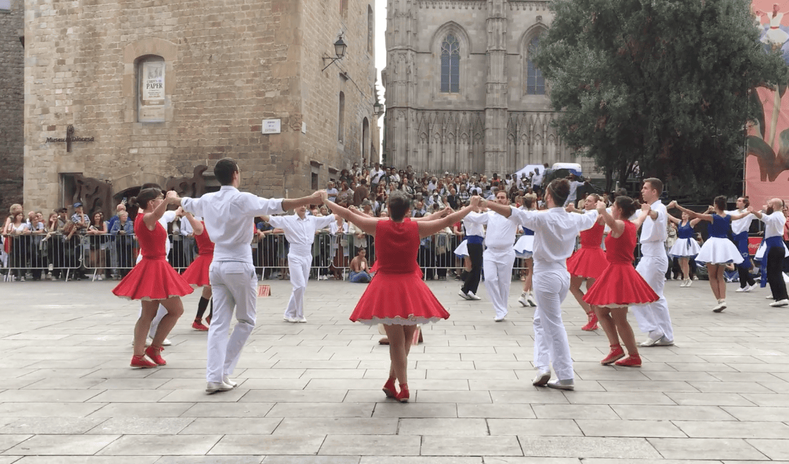 Traditional Sardana dancers perform in front of Barcelona Cathedral during La Mercè.