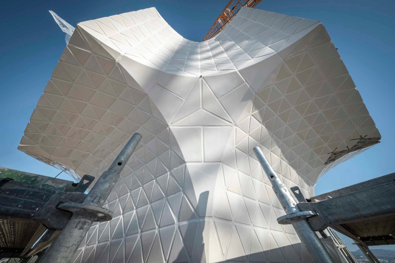 Installed core of the cross connecting the arms on the Tower of Jesus Christ at the Sagrada Familia