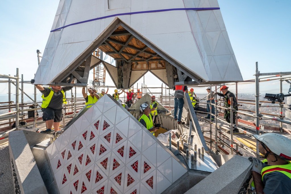 Lower arm of the cross being positioned on the Tower of Jesus Christ at the Sagrada Familia