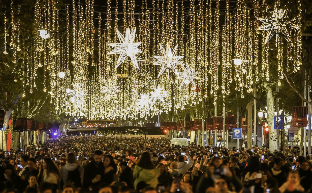 Large crowd gathered under golden Christmas lights and star decorations during Barcelona’s official lights switch-on.
