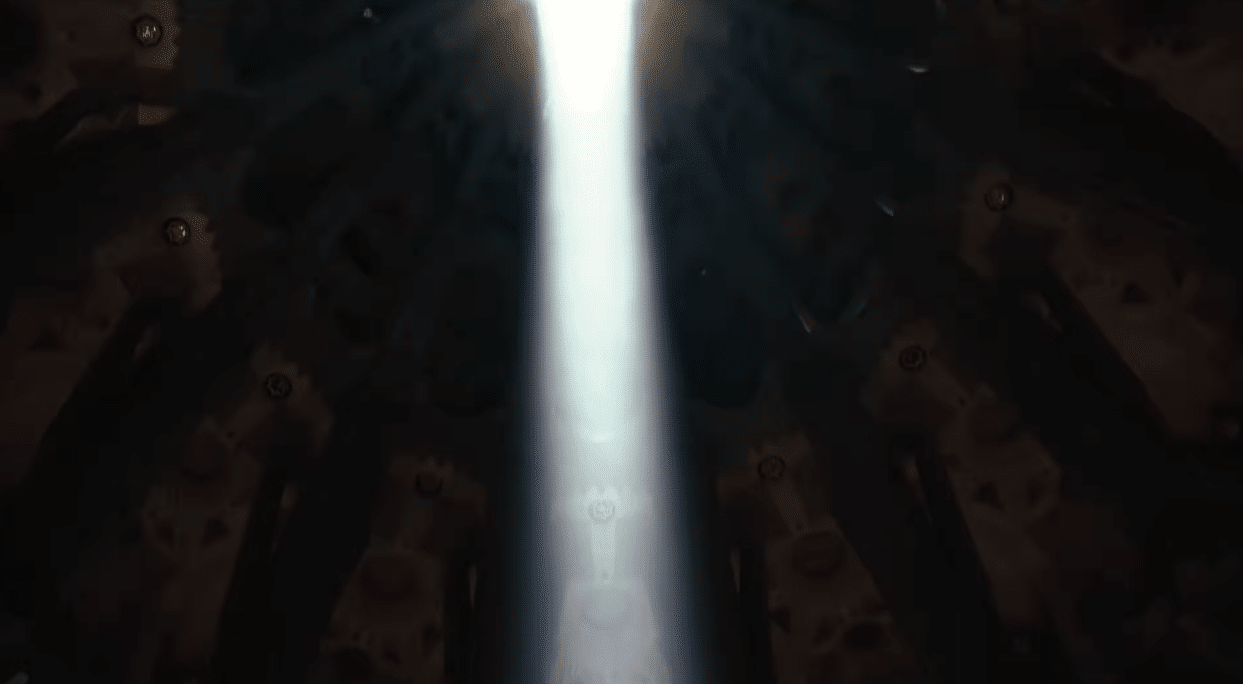 A powerful beam of light descending through the vaults of the Sagrada Familia during the Gaudí centenary celebration.