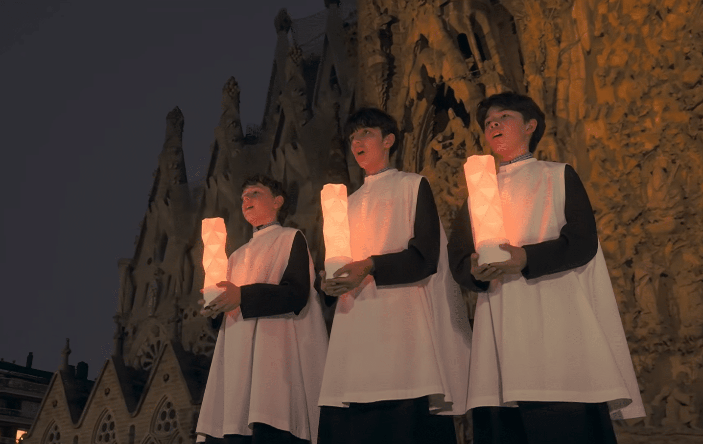 Young choir singers performing during the opening moments of the Gaudí centenary tribute at the Sagrada Familia.