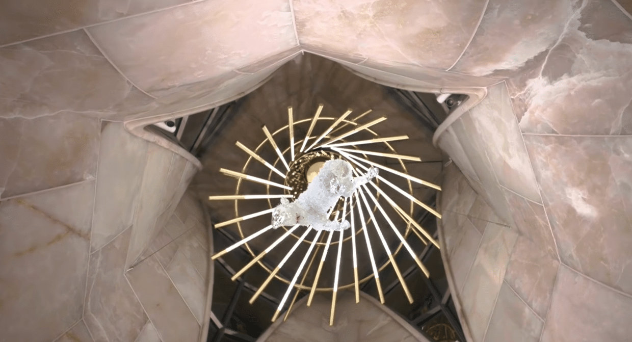 Illuminated dove symbol inside the Sagrada Familia during the centenary celebration of Antoni Gaudí.