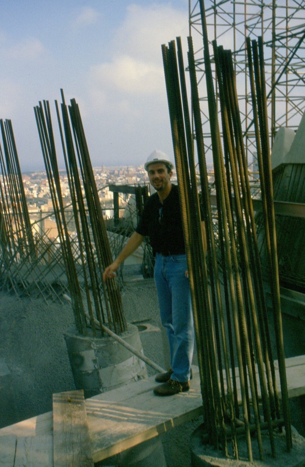 Inside the Columns: Javier at Sagrada Familia, 1999 Javier standing among the rebar columns inside the Sagrada Familia in 1999