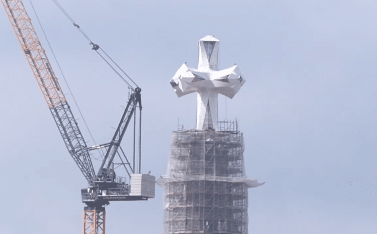 Close-up of the ceramic and glass cross crowning the Jesus Tower at the Sagrada Familia