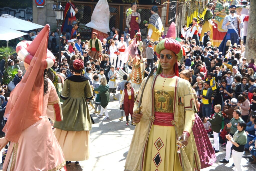 Traditional La Mercè parade with Gegants and colorful festival characters in Barcelona