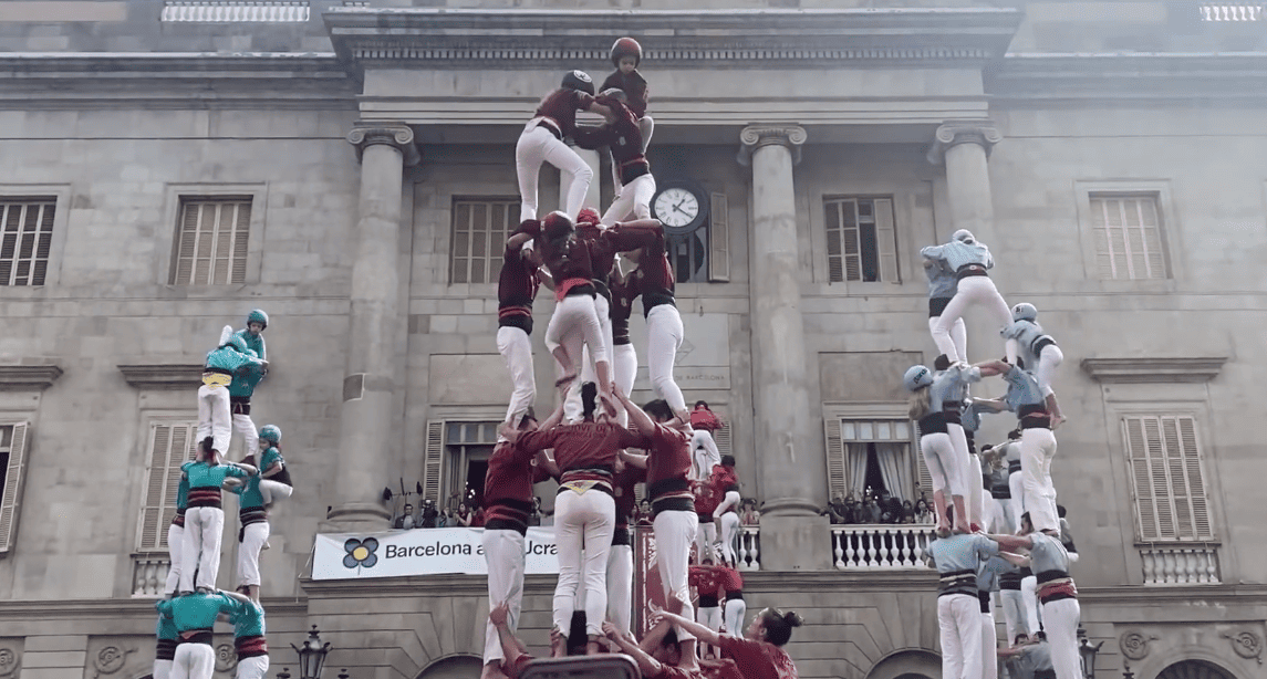 Castellers forming a human tower in Plaça Sant Jaume during La Mercè