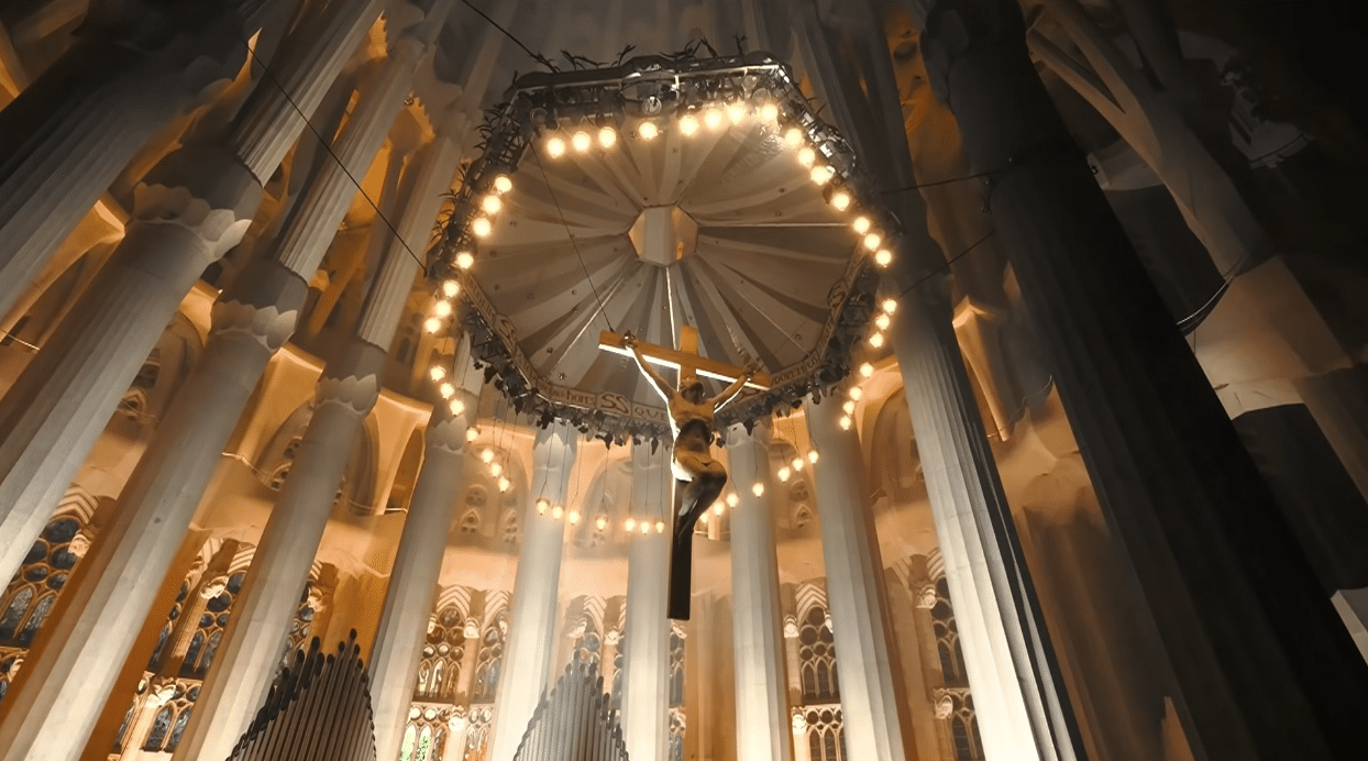 Light illuminating the interior of the Sagrada Familia during the centenary tribute.