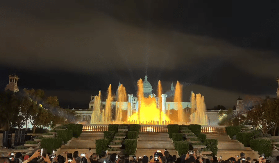 Magic Fountain of Montjuïc with yellow and orange lights during the 2025 reopening show in Barcelona