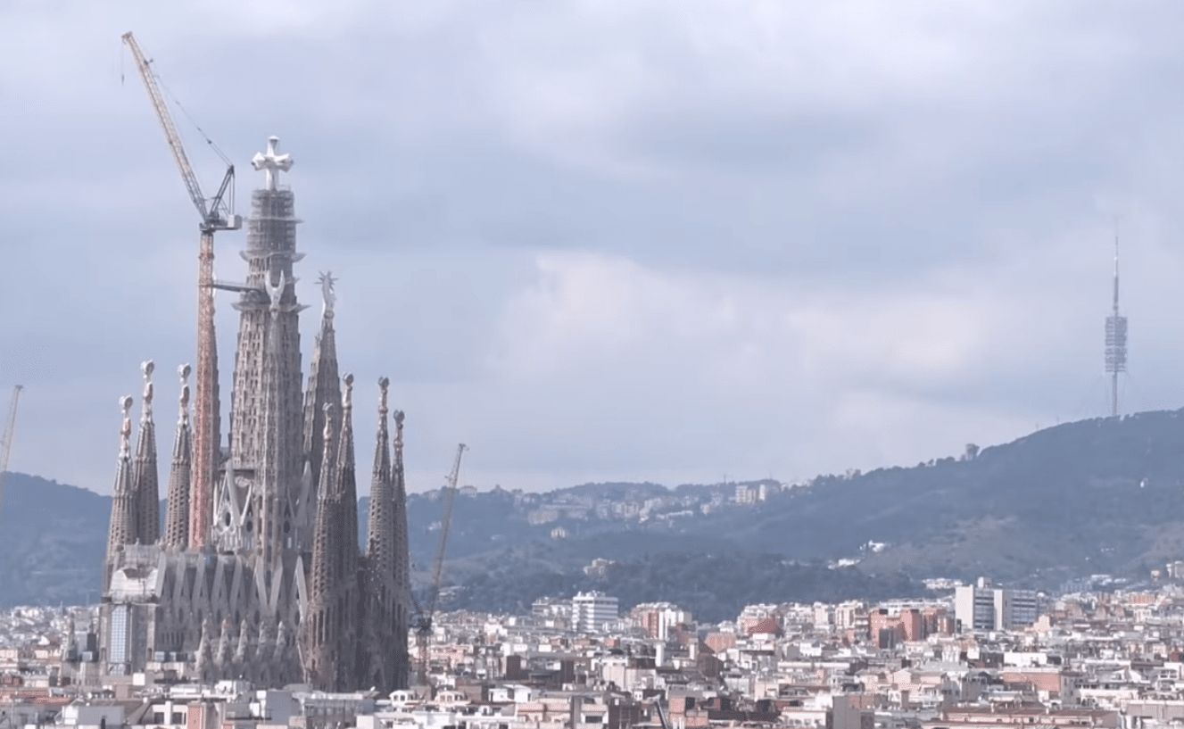 Sagrada Familia skyline view with the newly revealed cross of the Jesus Tower rising above Barcelona