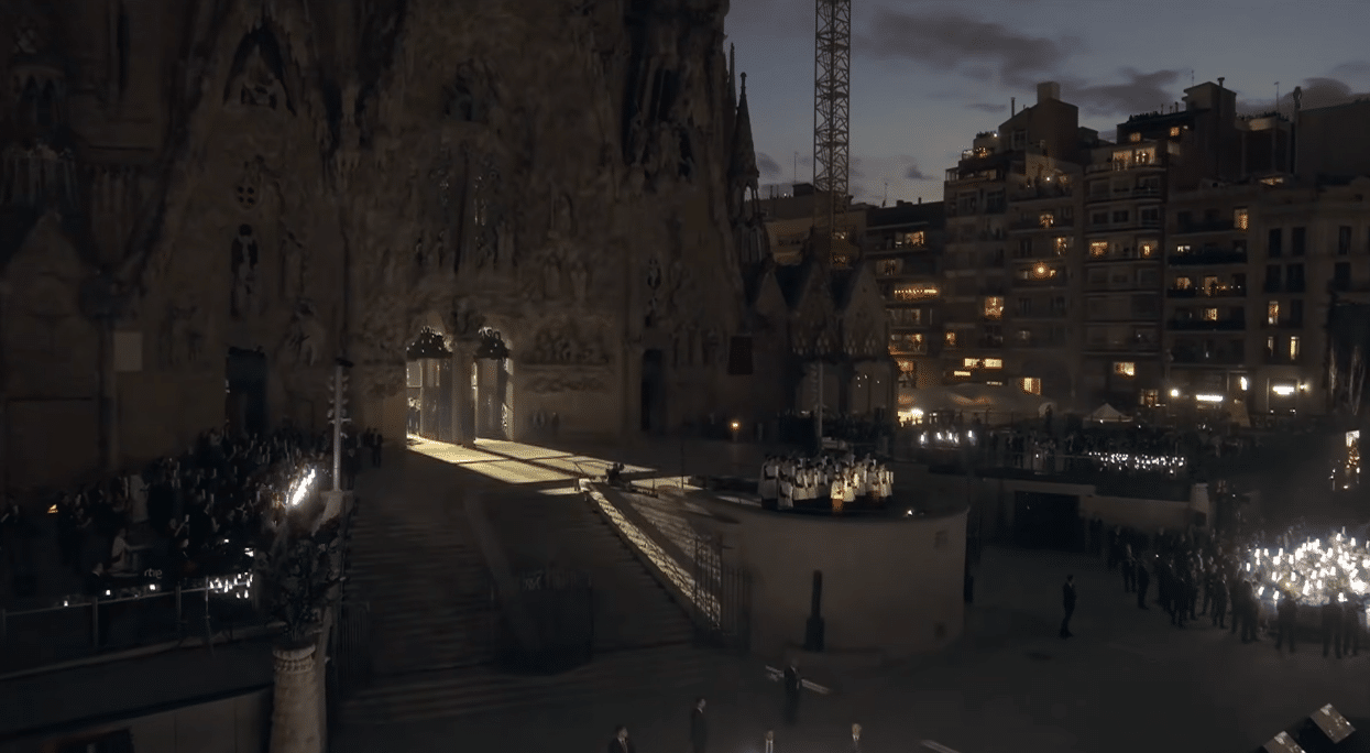 Illuminated pathway leading toward the Sagrada Familia during the centenary celebration.