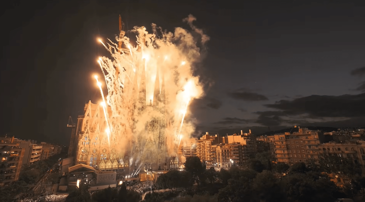 Spectacular fireworks exploding around the Sagrada Familia during the centenary celebration of Antoni Gaudí.