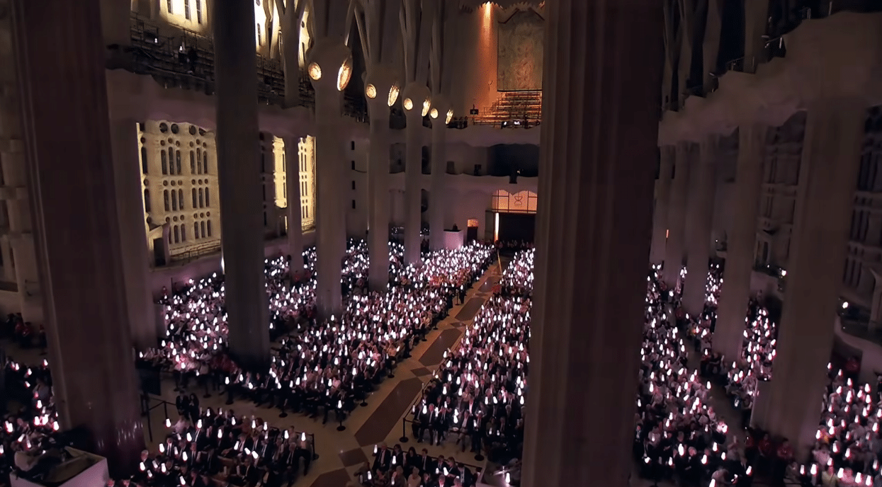 Choirs and attendees gathered inside the Sagrada Familia during the centenary tribute to Antoni Gaudí.
