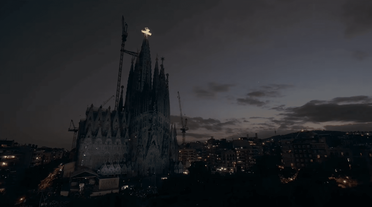 The Sagrada Familia illuminated at dusk during the centenary tribute to Antoni Gaudí.