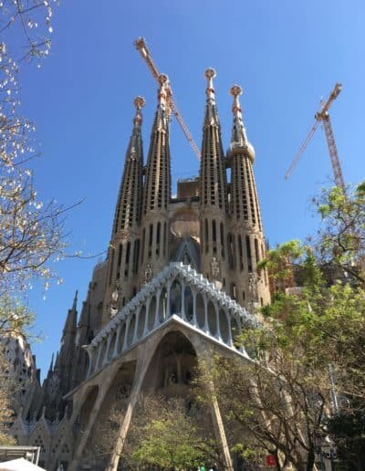Sagrada Família under clear blue skies in springtime Barcelona