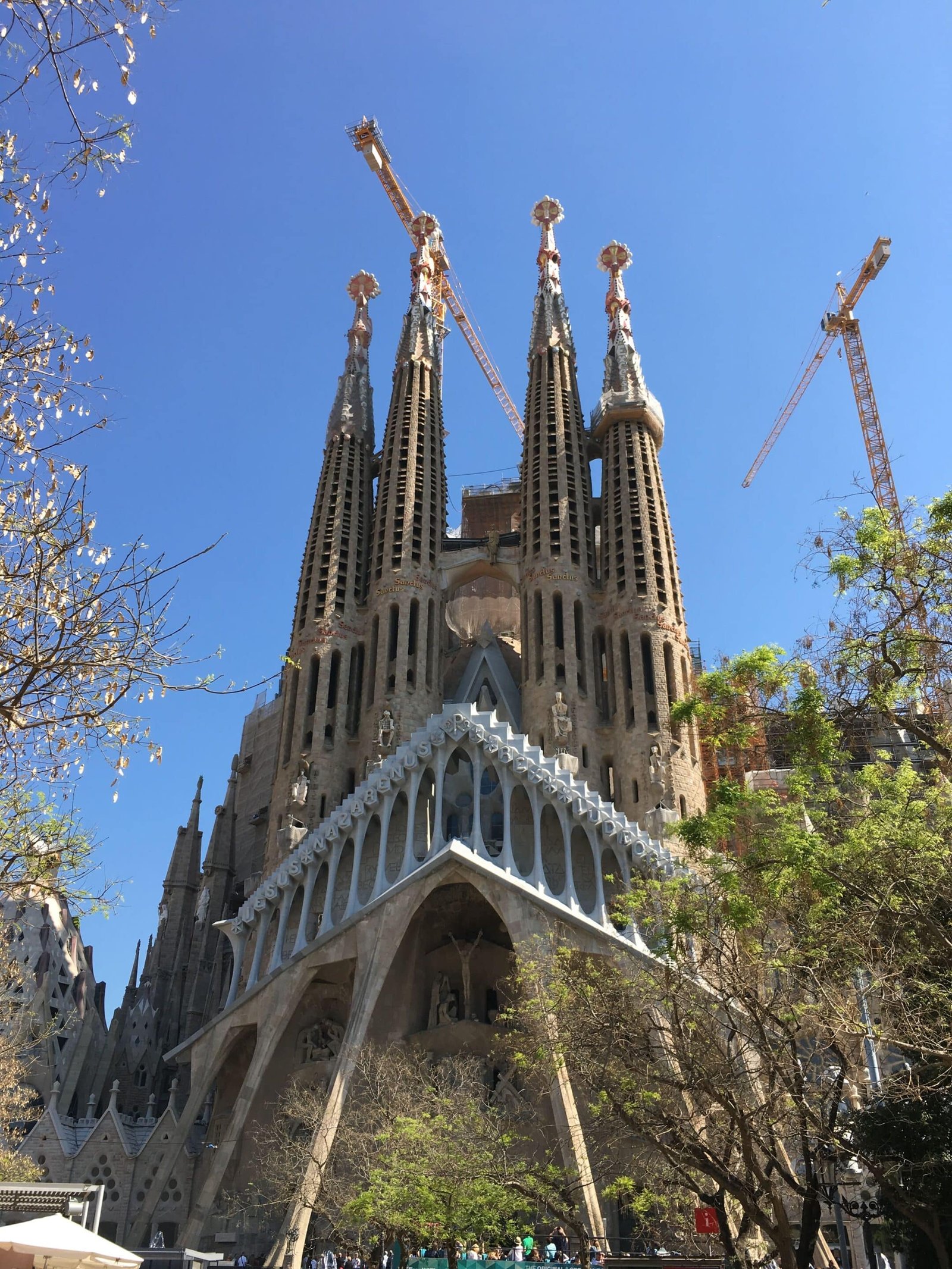Sagrada Família under clear blue skies in springtime Barcelona