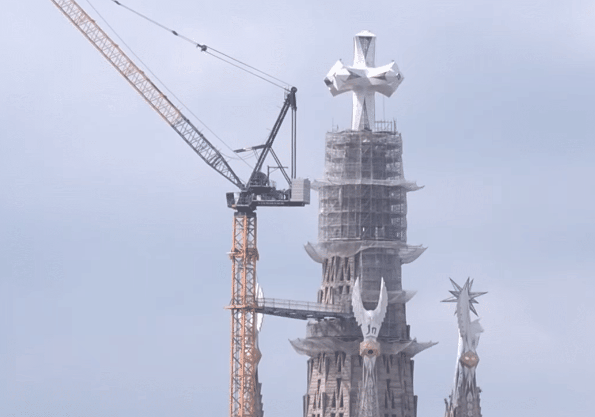 Jesus Tower of the Sagrada Familia with the cross visible above the scaffolding during the final construction phase