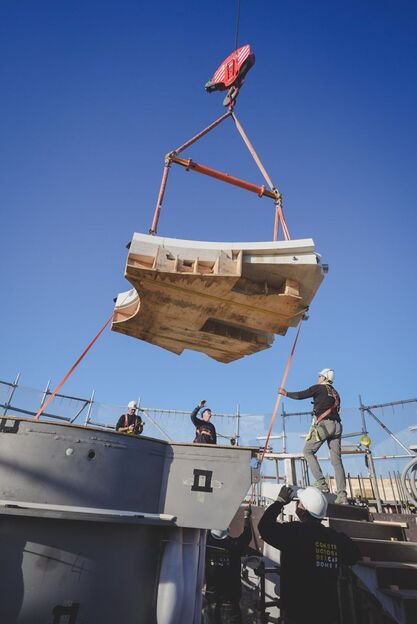 Workers installing a stone platform inside the Jesus Tower of the Sagrada Família, marking a key milestone in 2025 construction.