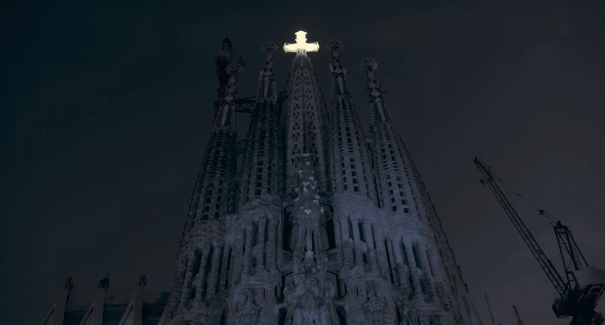 The Tower of Jesus illuminated at night during the Antoni Gaudí centenary celebration.