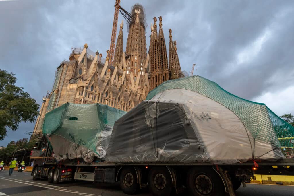 Arrival of the central core of the cross for the Tower of Jesus Christ at the Sagrada Familia transported by truck in Barcelona